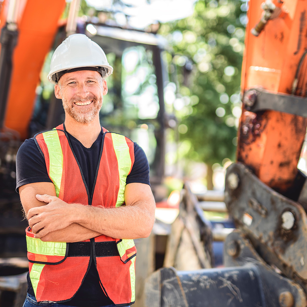 Worker next to digger
