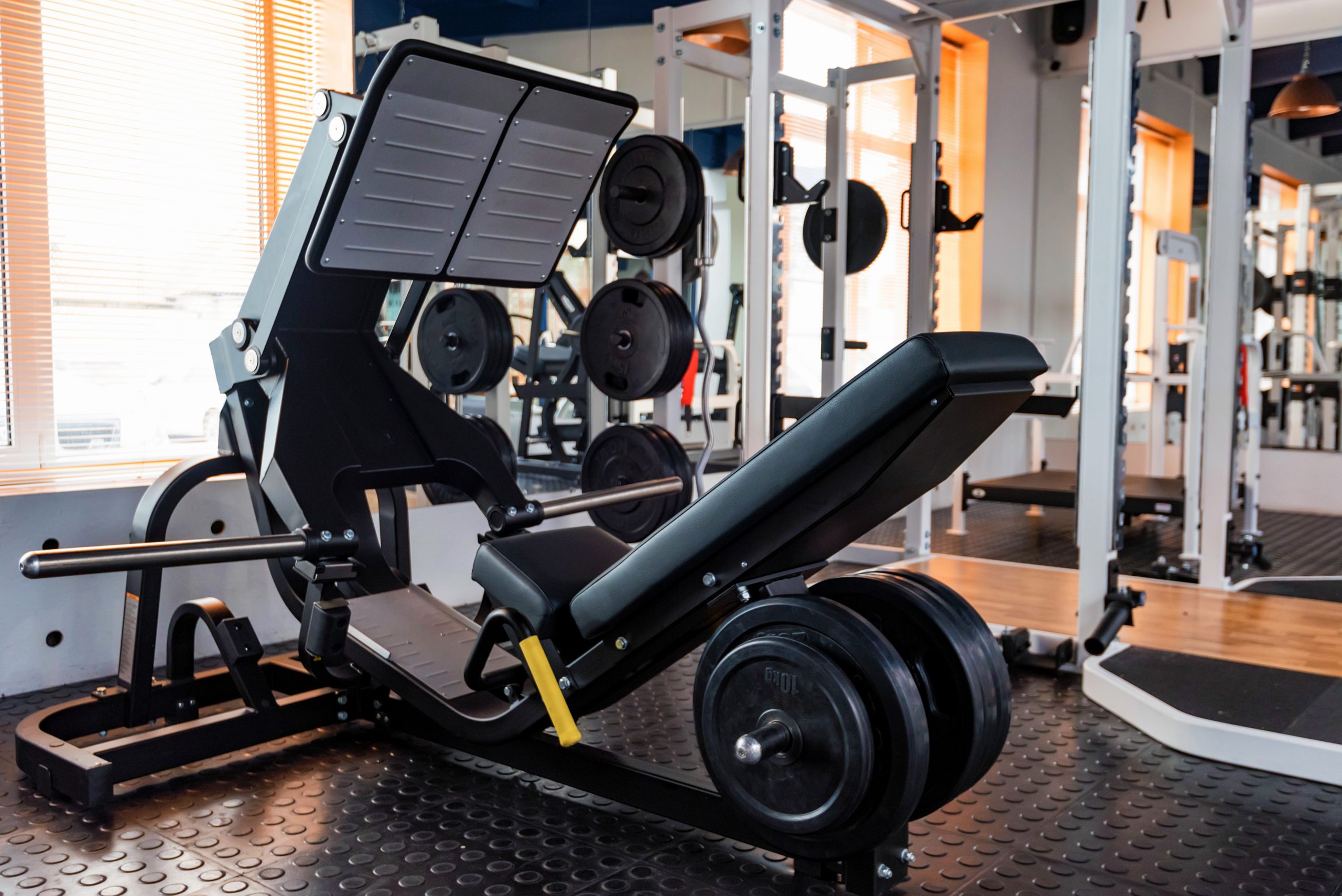 Empty leg press exercise machine in modern gym